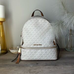 Barely Used Monogramed Michael Kors MK backpack